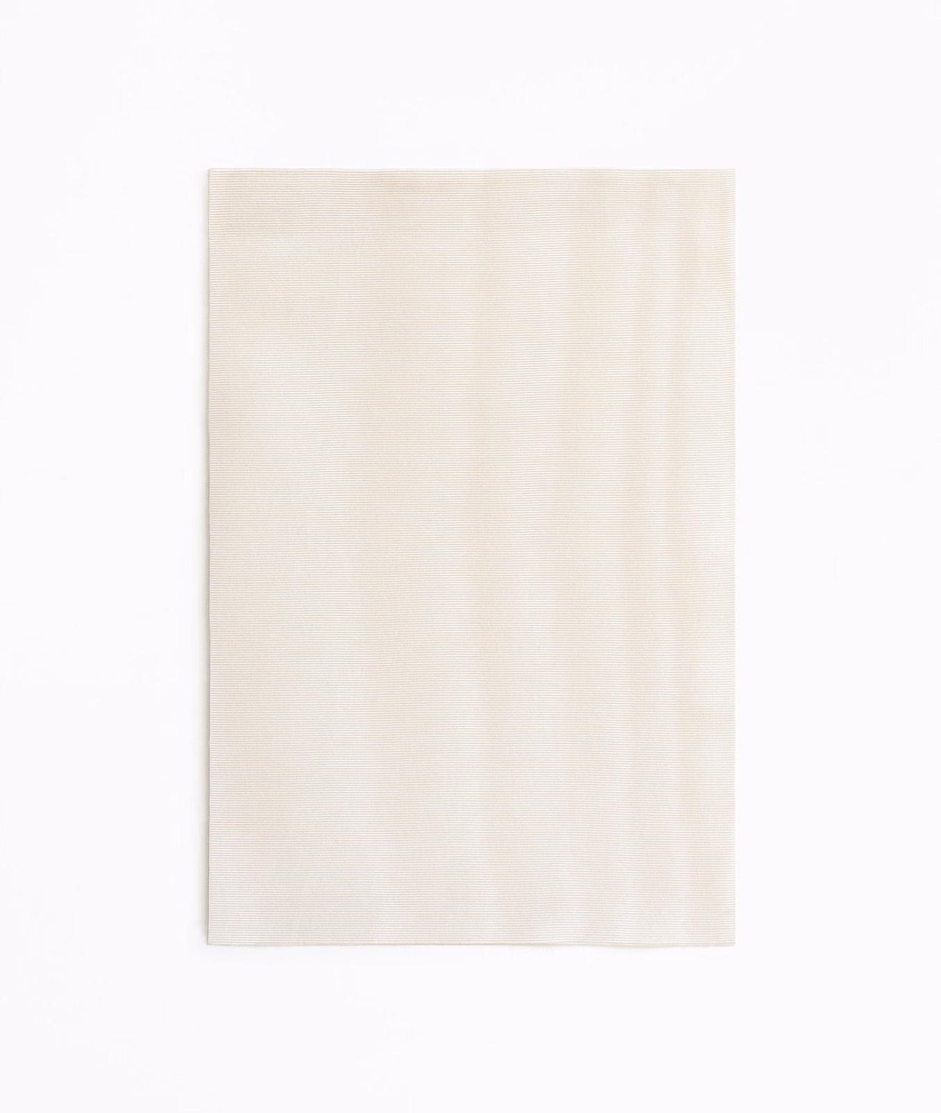 Pale ivory-blush curtain fabric with subtle vertical tonal striations