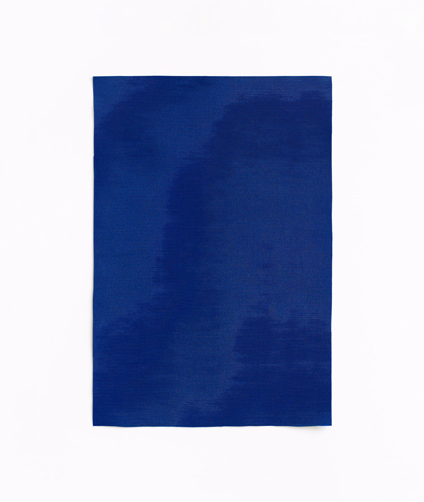 Deep cobalt blue woven swatch with subtle darker and lighter abstract tonal patches