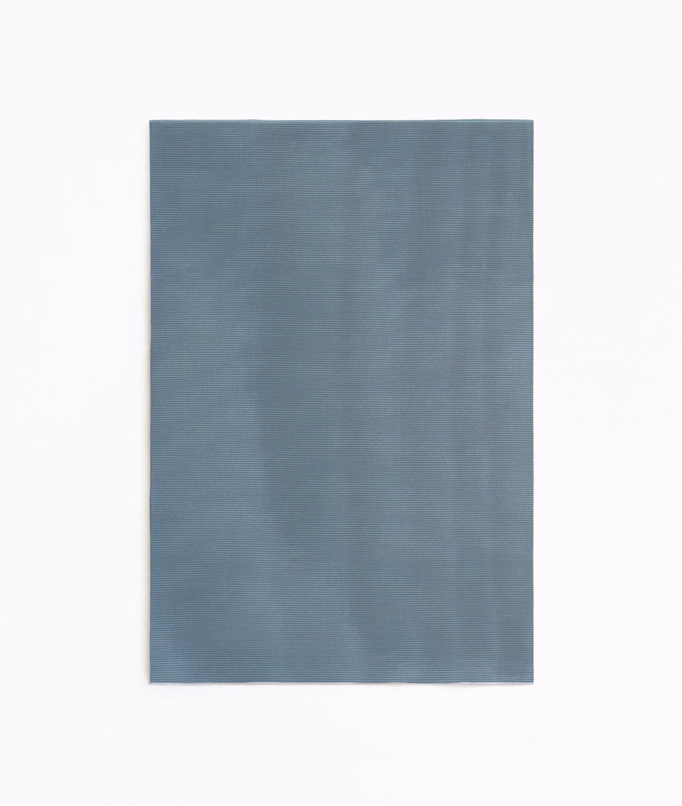 Cool blue-grey curtain cloth with subtle tonal striations and softly textured surface