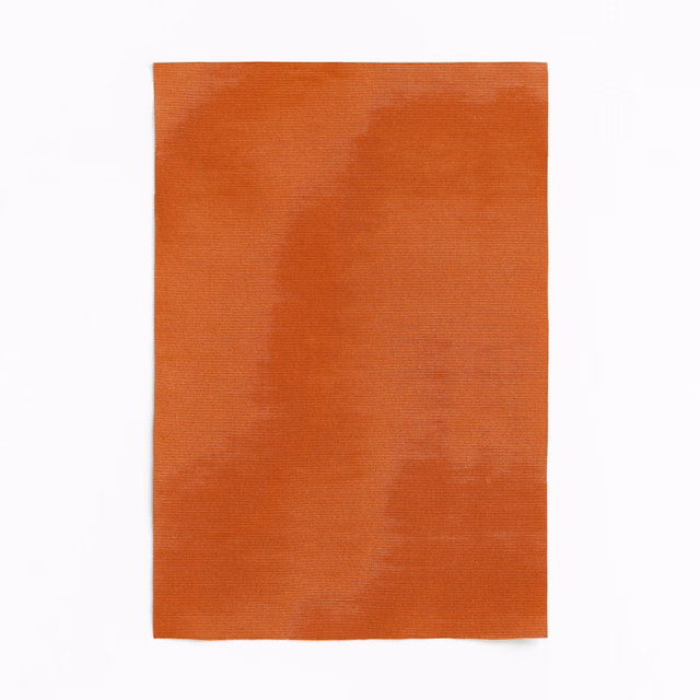 Warm mandarin-orange woven swatch with softly cloudy tonal bands and fine texture