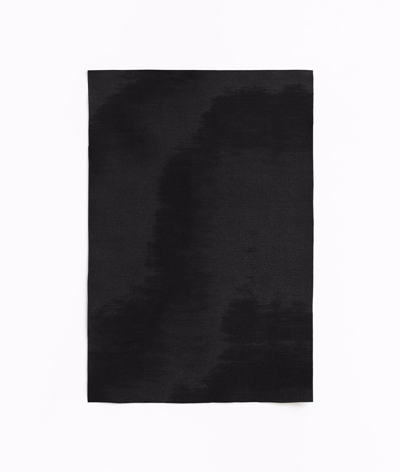 Near-black woven textile with soft charcoal clouding and restrained horizontal sheen