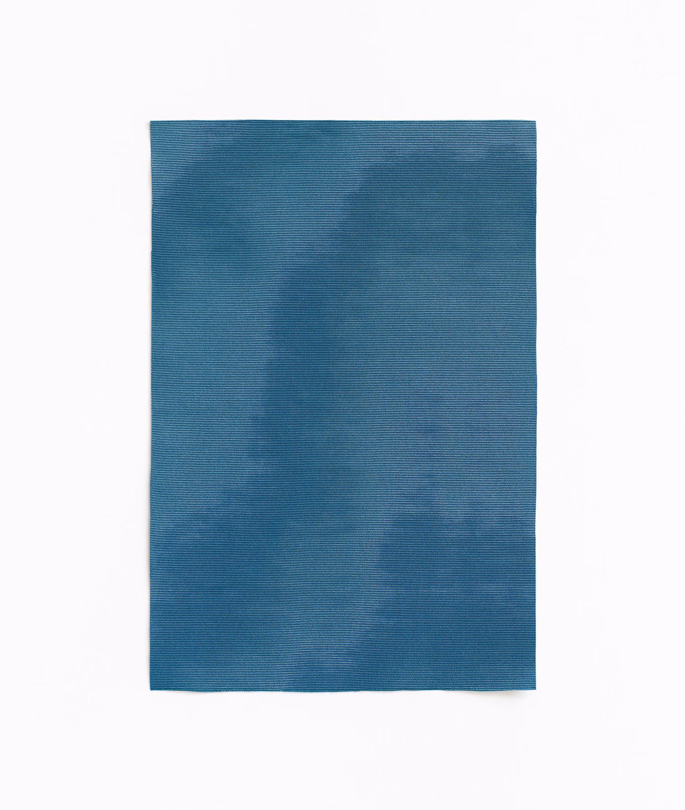 Deep ottanio teal fabric with softly blurred tonal patches and fine woven texture