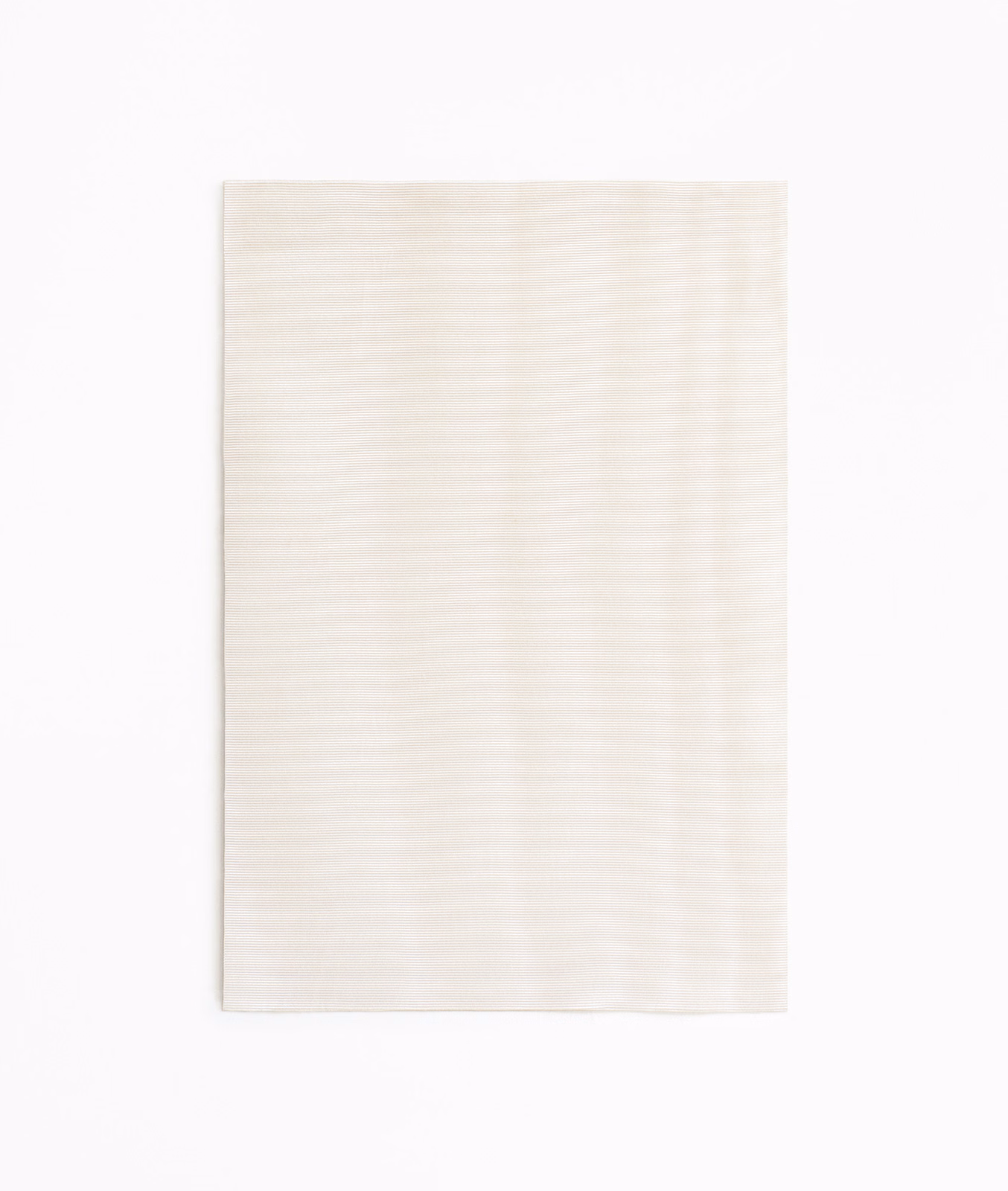 Pale powder-ivory curtain fabric with subtle vertical tonal movement and soft sheen