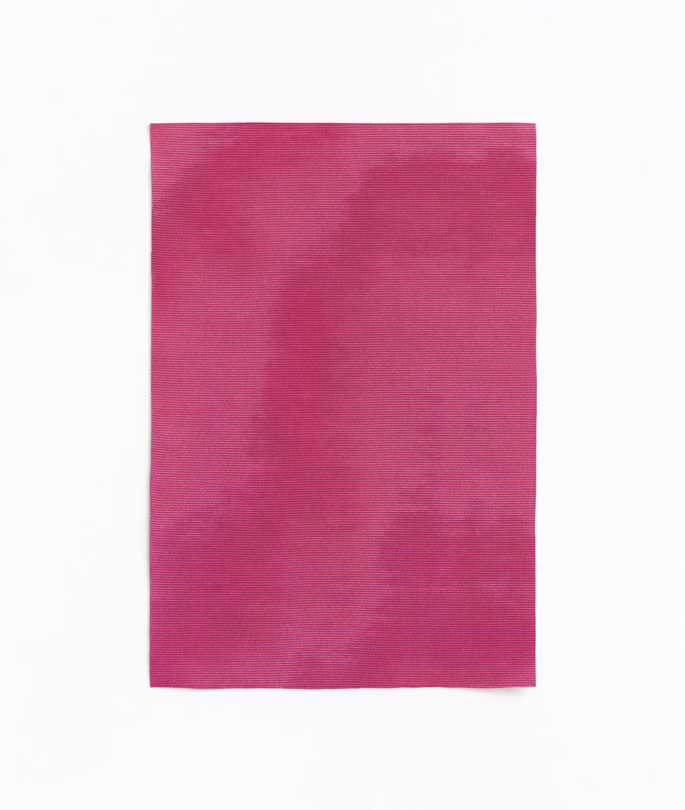 Vivid fuchsia magenta fabric with soft clouded tonal variations and subtle weave