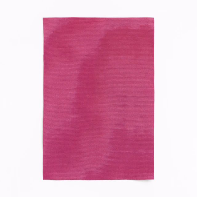 Vivid fuchsia magenta fabric with soft clouded tonal variations and subtle weave
