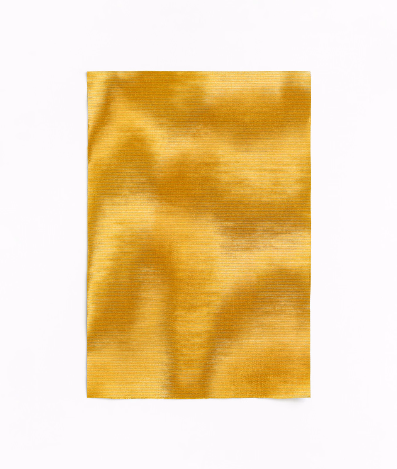 Warm ochre-gold curtain fabric with fine weave and softly mottled tonal shading