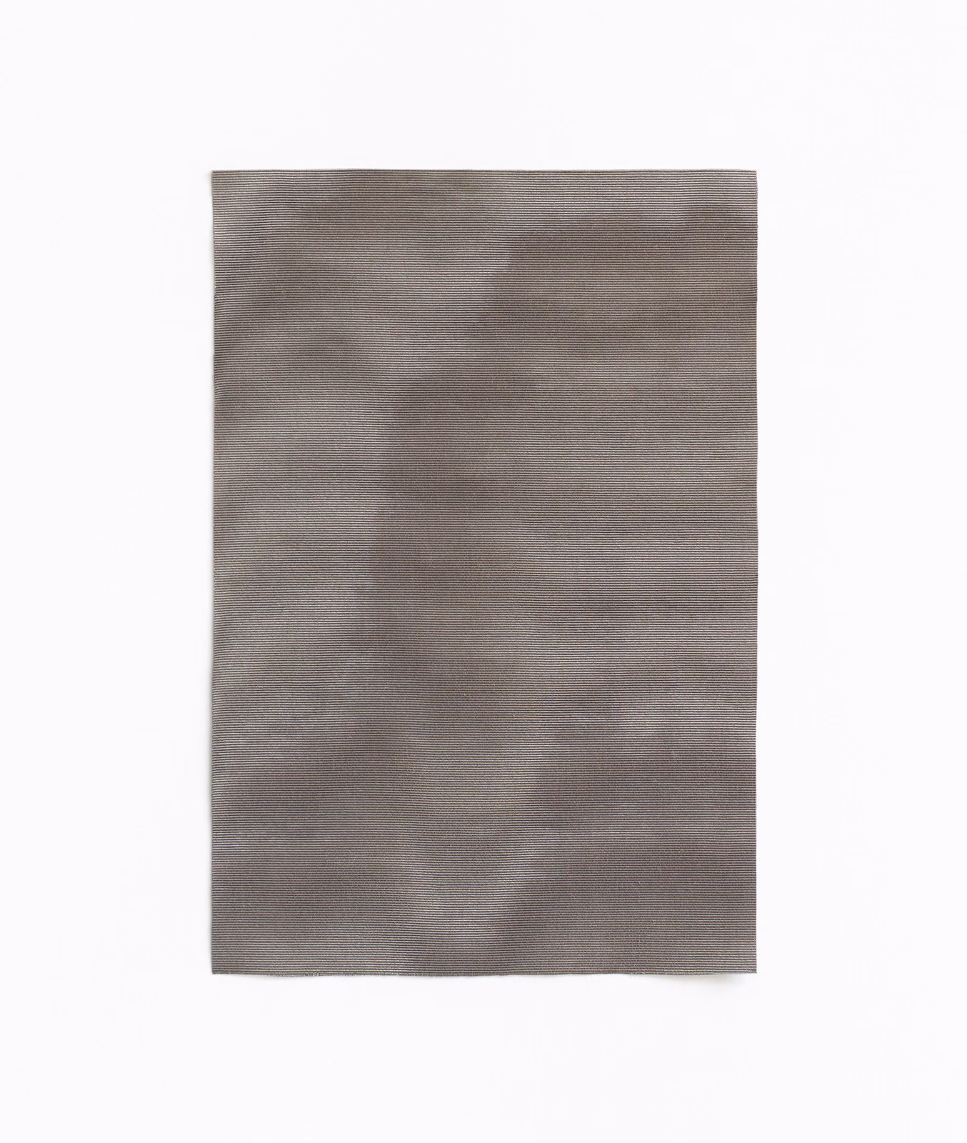 Soft grey taupe woven fabric with broad cloudy tonal variation