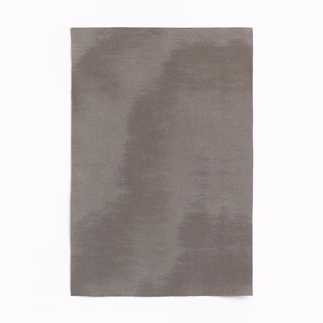 Soft grey taupe woven fabric with broad cloudy tonal variation