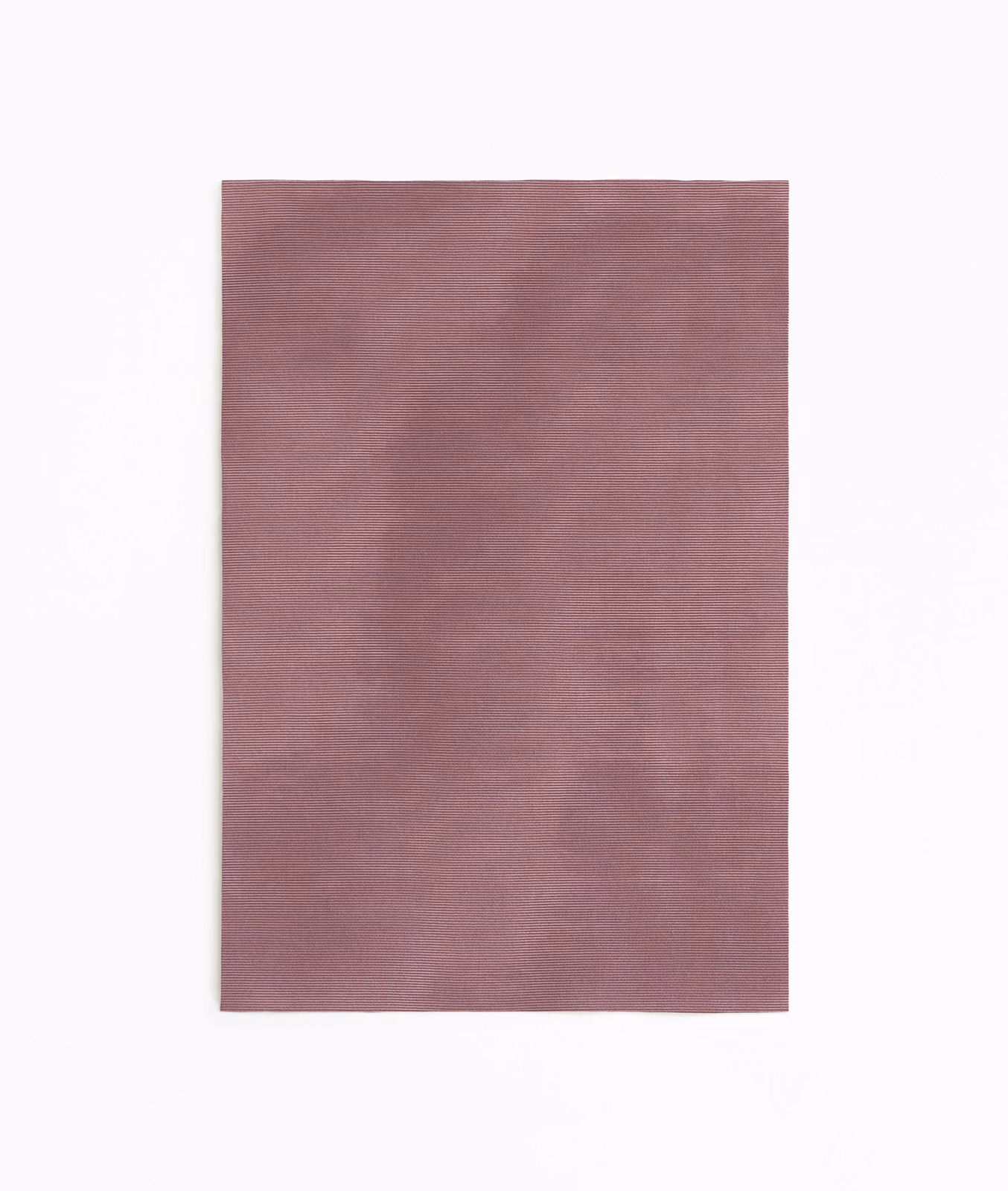 Dusty vieux rose curtain fabric with a soft, subtly rippled woven surface