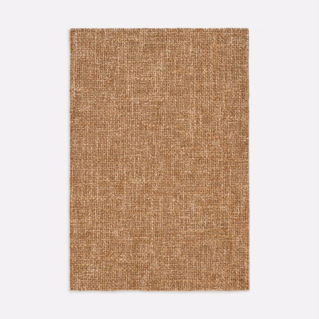 Warm Anversa Ocra swatch showing a dense ochre-brown plain weave with pale yarn flecks.