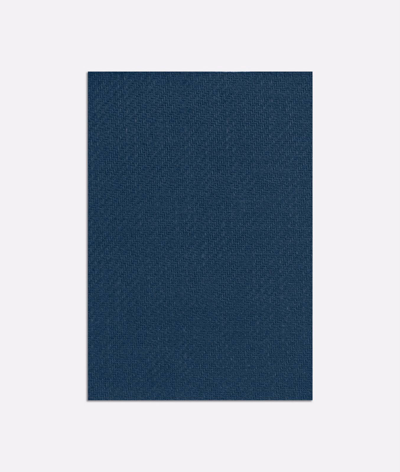 Deep indigo blue curtain textile with a fine, subtly crosshatched woven surface