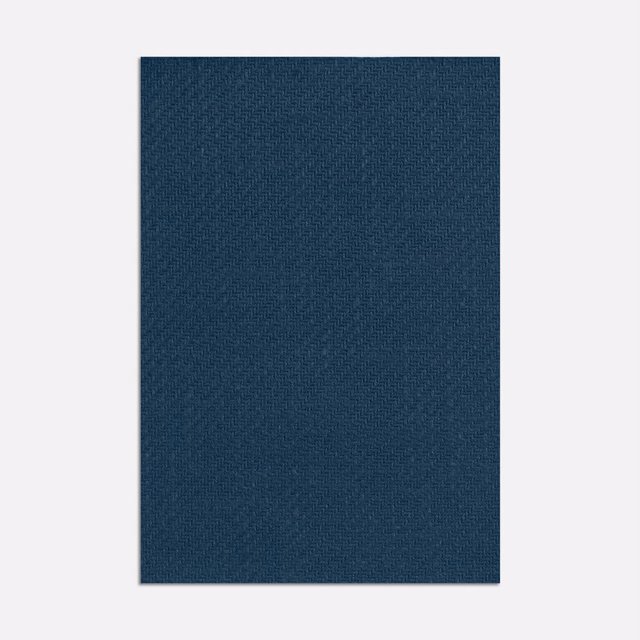 Deep indigo blue curtain textile with a fine, subtly crosshatched woven surface