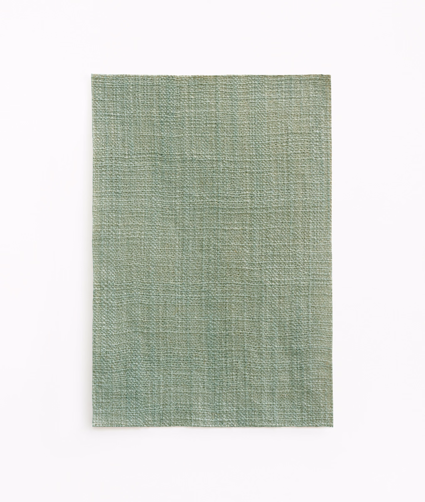 Pale celadon green fabric with a fine, subtly crosswoven textured surface