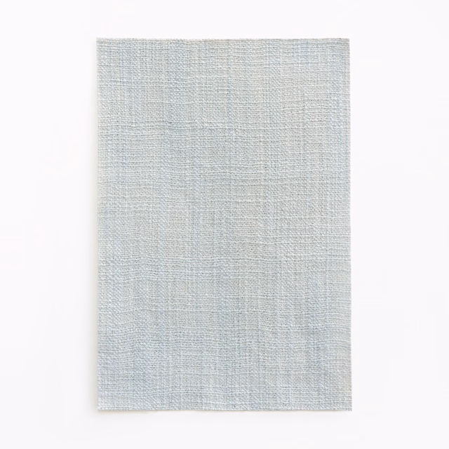 Pale glacier blue-grey woven fabric with subtle vertical striations
