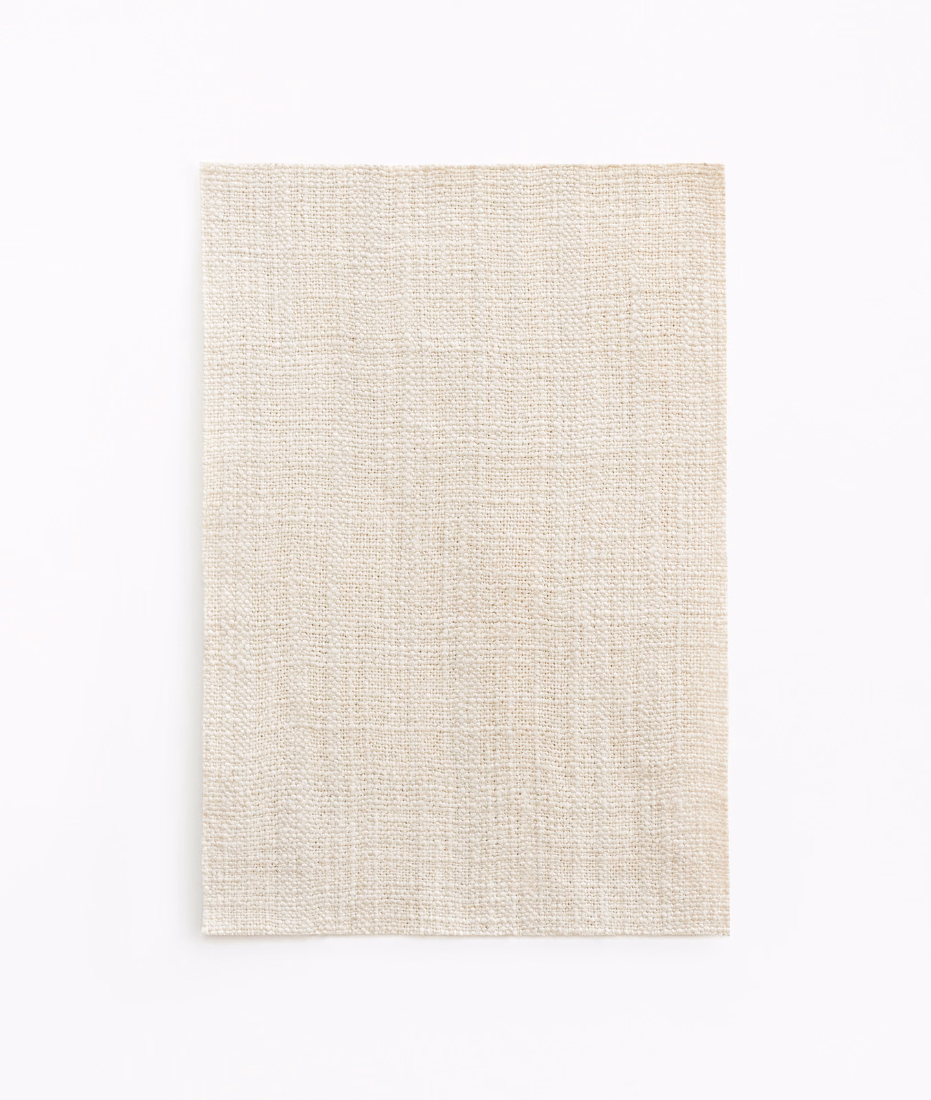 Warm ivory-cream curtain swatch with fine irregular crossweave and subtle tactile texture