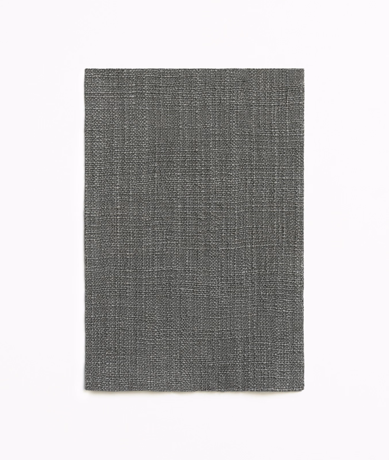 Charcoal-grey woven textile with a subtle irregular grid and fine salt-and-pepper texture