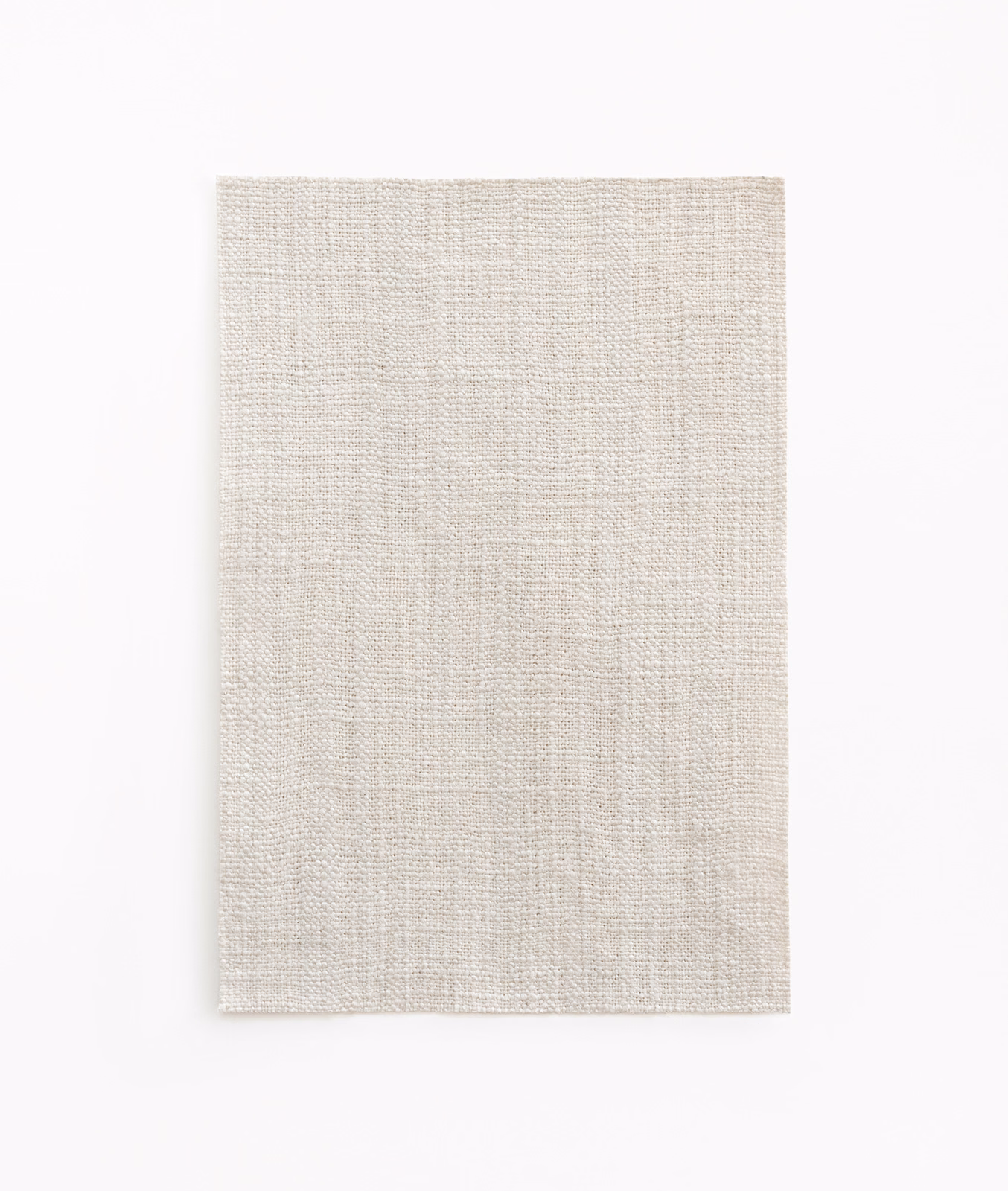 Pale pearl-grey woven swatch with fine crosshatched texture and subtle tonal flecks