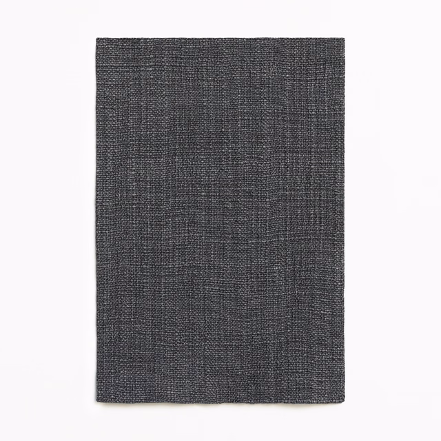 Deep charcoal grey textile with a subtle crosshatched woven surface