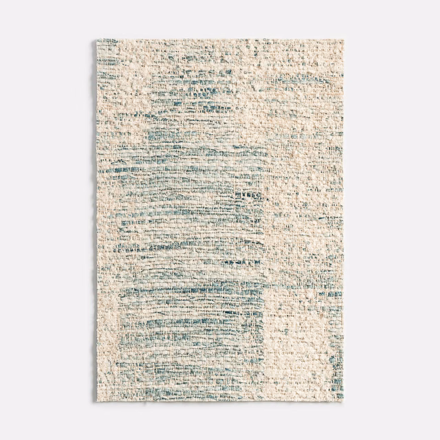 Chalky cream woven swatch with broken teal-blue horizontal painterly markings