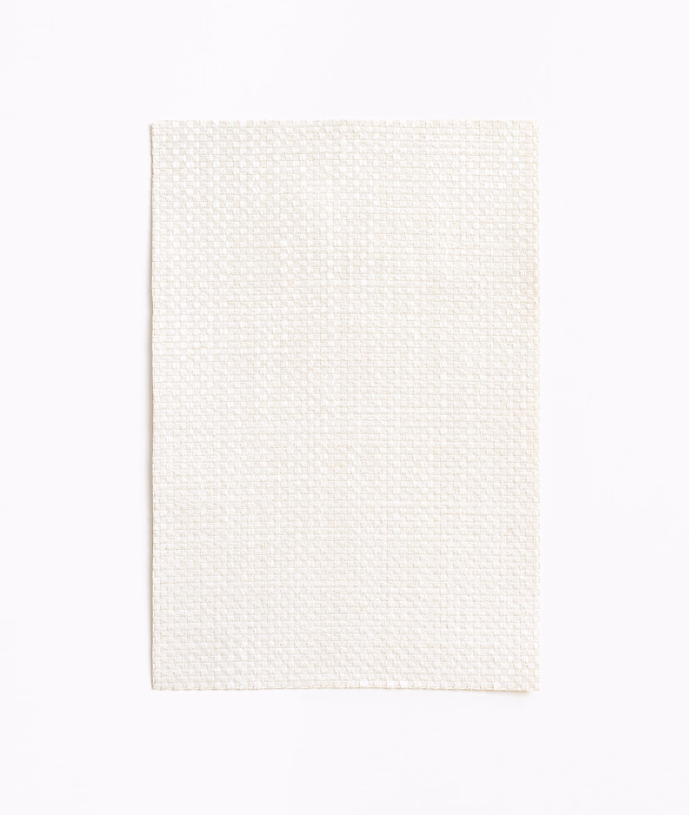 Warm ivory Aut Aut textile with a fine, softly raised basketweave texture