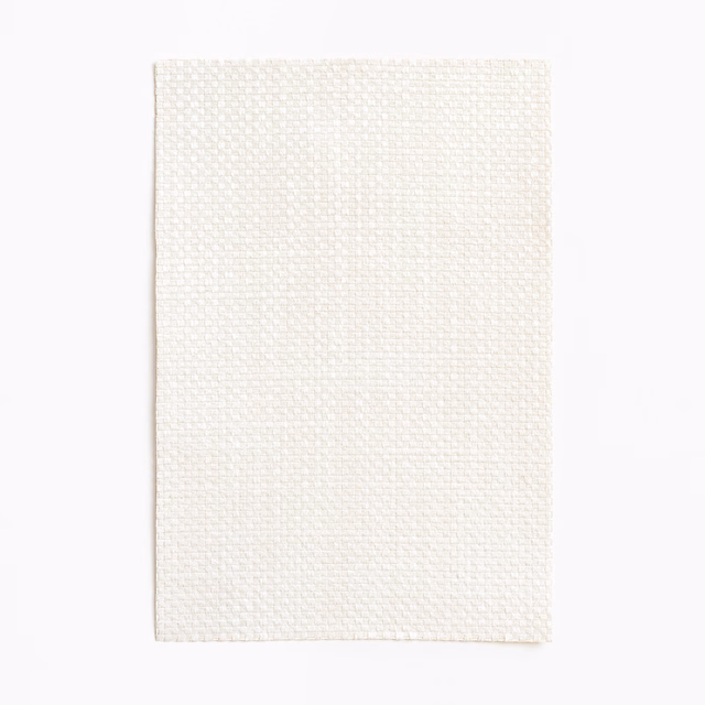 Warm ivory Aut Aut textile with a fine, softly raised basketweave texture