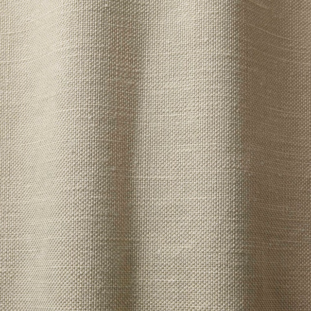 Warm ivory-beige woven curtain fabric with subtle vertical tonal bands and tactile texture