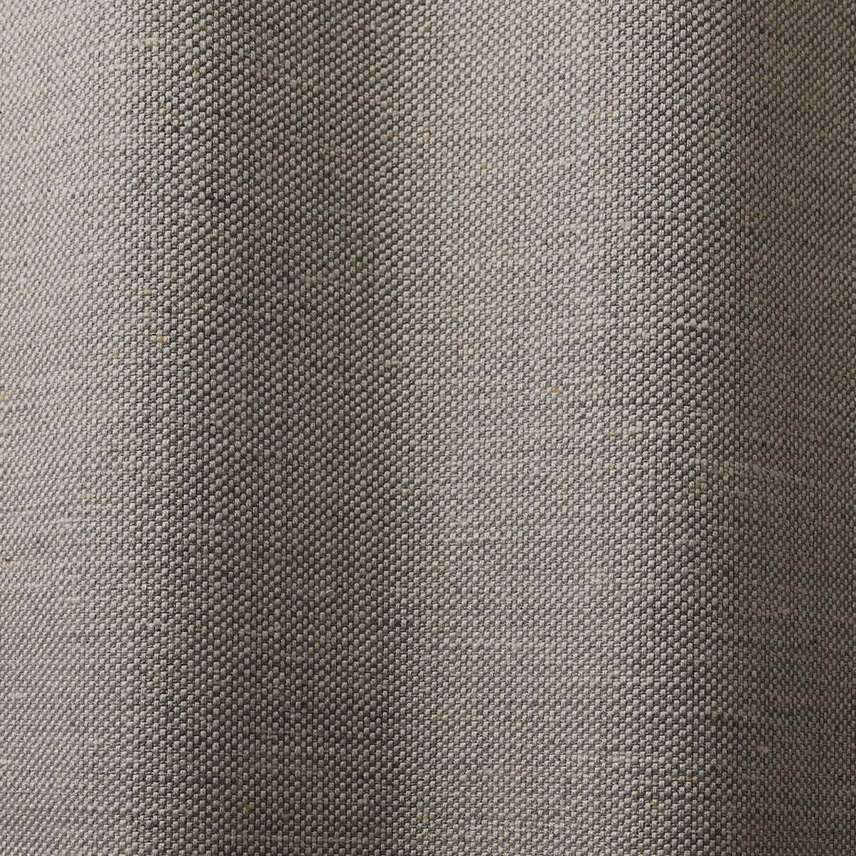 Close-up of cool stone-grey fabric with compact pebbled woven texture