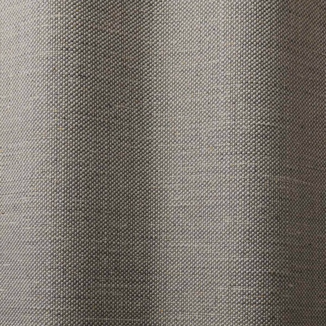 Close-up of cool stone-grey fabric with compact pebbled woven texture