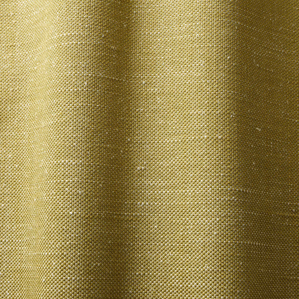 Close-up of tightly woven muted lemon-lime fabric with olive shading in vertical folds