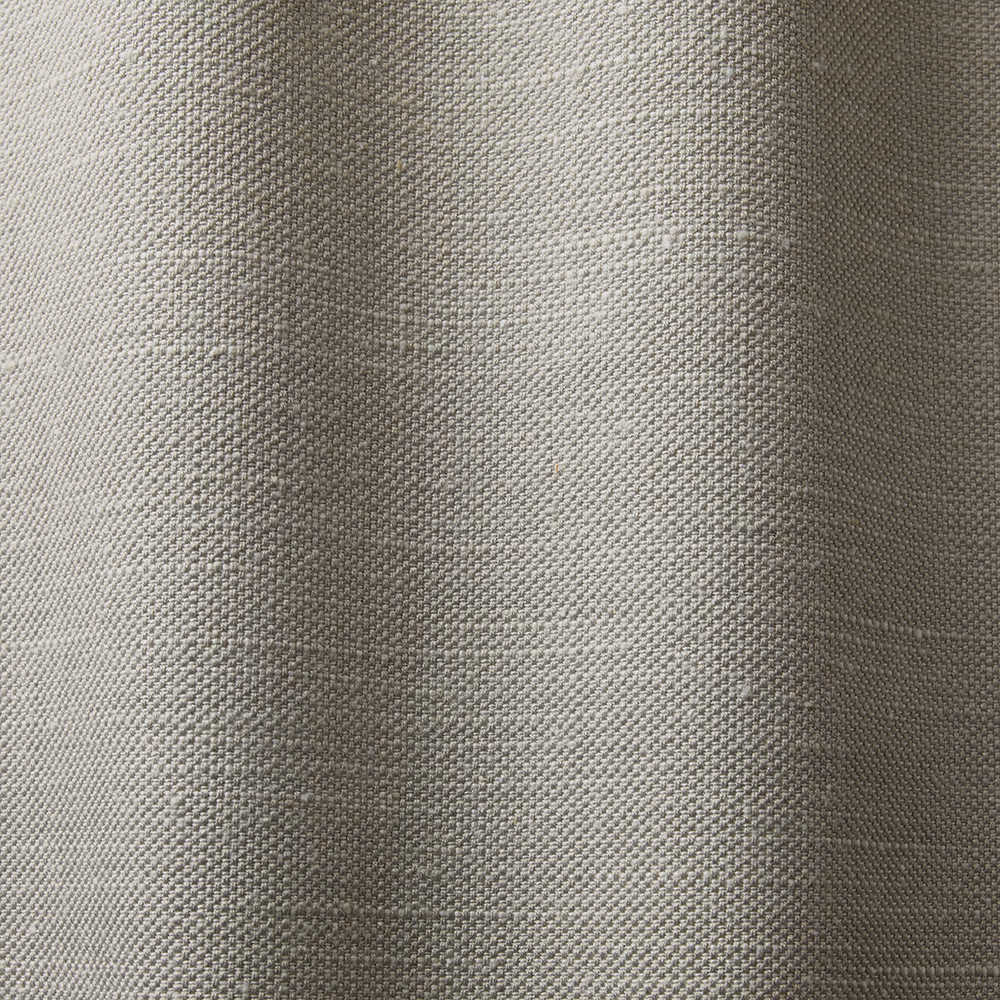 Close-up of cool light grey fabric with a small, pebbled woven texture