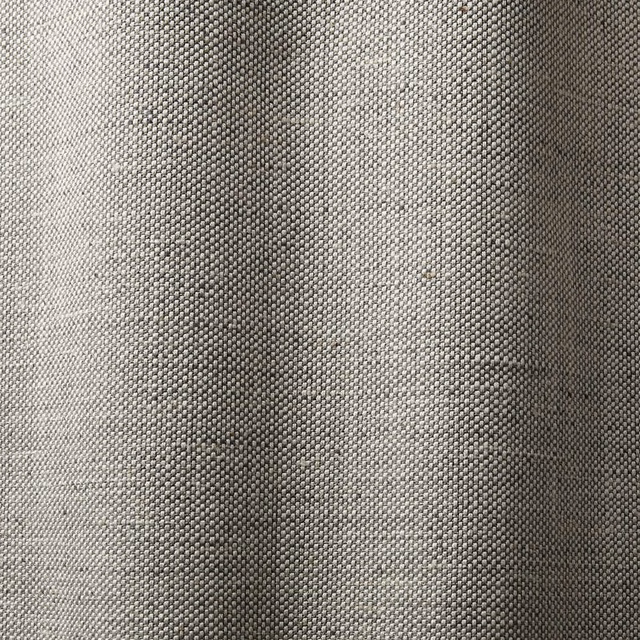 Close view of dense sand-grey woven fabric with subtle tonal texture