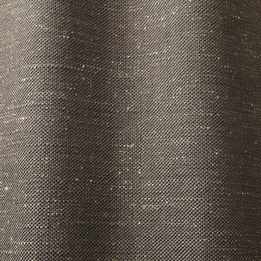 Charcoal brown woven textile with fine pale flecks and softly varied tonal shading