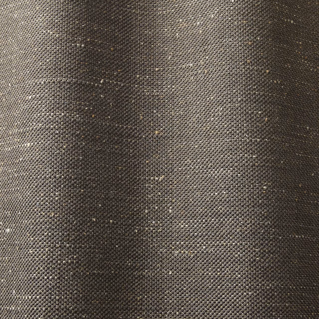 Charcoal brown woven textile with fine pale flecks and softly varied tonal shading