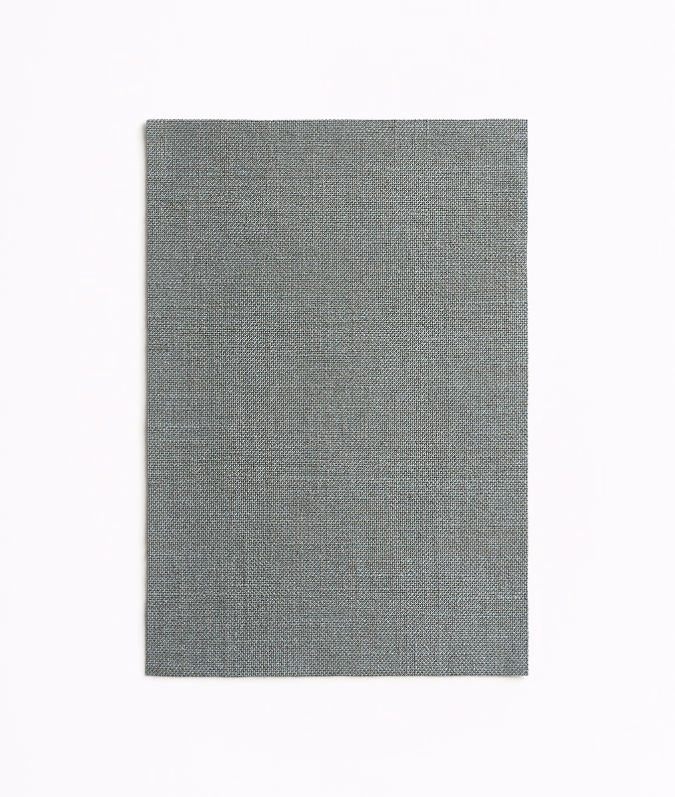 Cool grey-green chambray weave with subtle mottling on a rectangular swatch