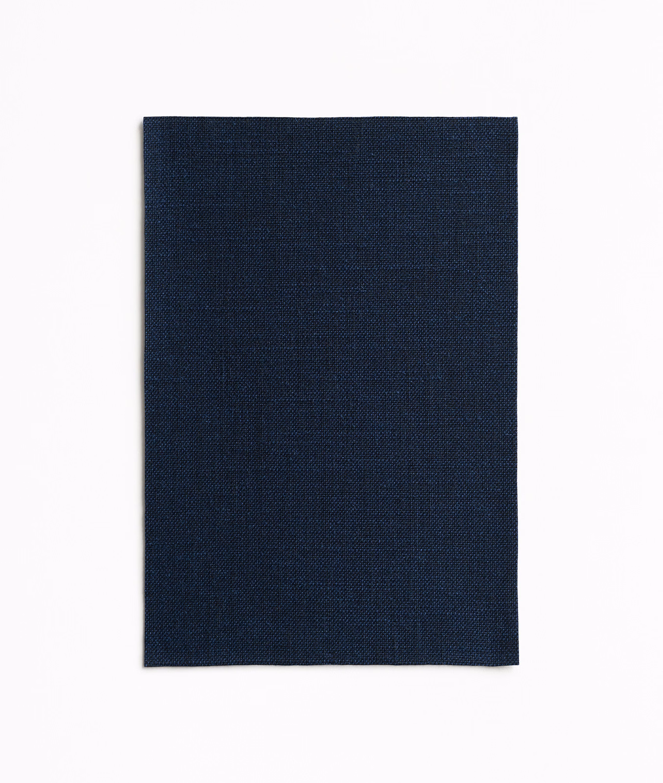 Deep ink navy fabric swatch showing a fine, subtly textured woven surface