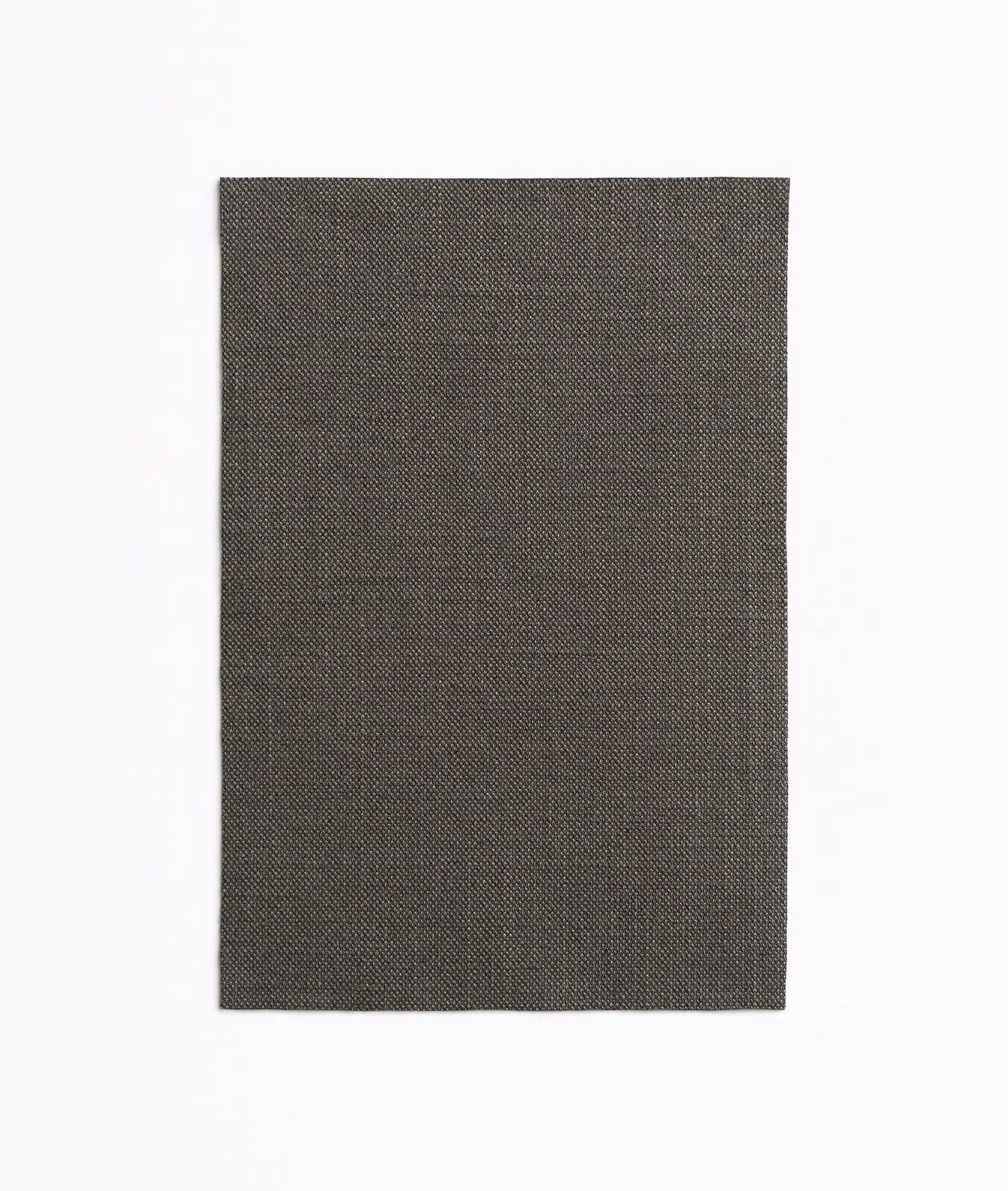 Deep charcoal-grey curtain cloth with a minute, evenly patterned woven surface.