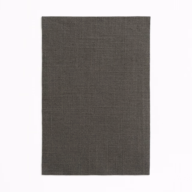 Deep charcoal-grey curtain cloth with a minute, evenly patterned woven surface.