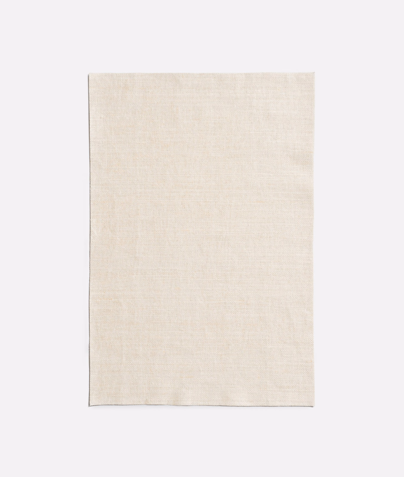 Pale ivory Caolino swatch showing a fine, softly varied woven surface