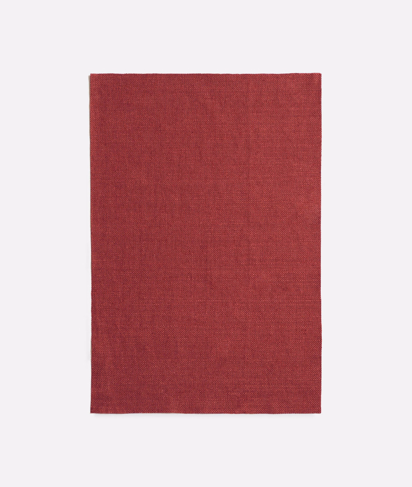 Deep cherry-red plain woven fabric with a subtly mottled textured surface