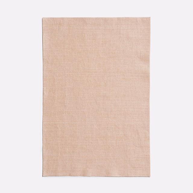 Pale blush-pink Dedar fabric swatch with fine texture and subtle tonal floral patterning