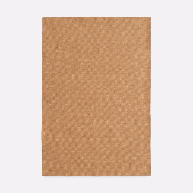 Warm terracotta plain-weave fabric with subtle tobacco tonal variation