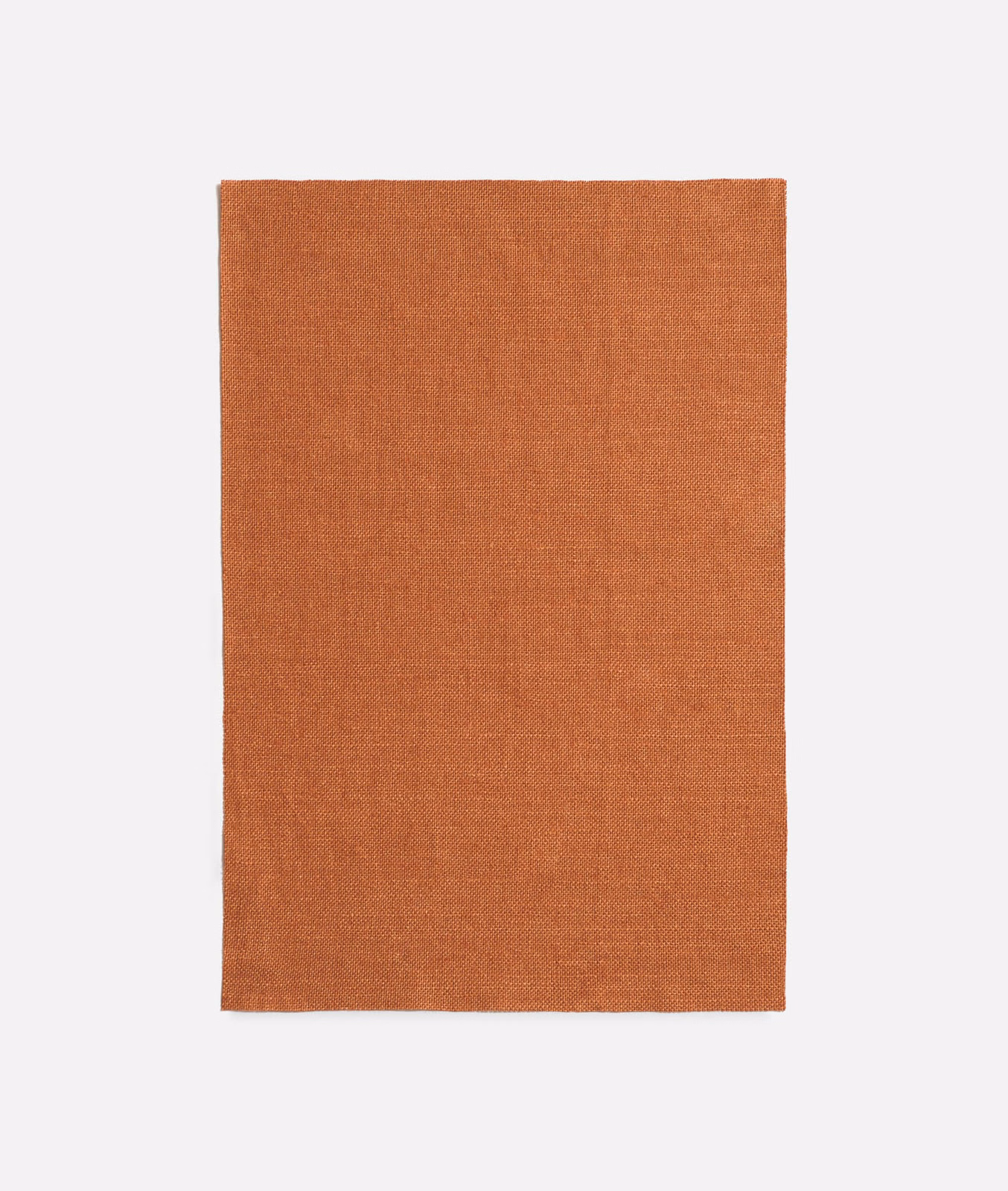 Warm burnt-terra plain woven fabric with a subtle fine-textured surface