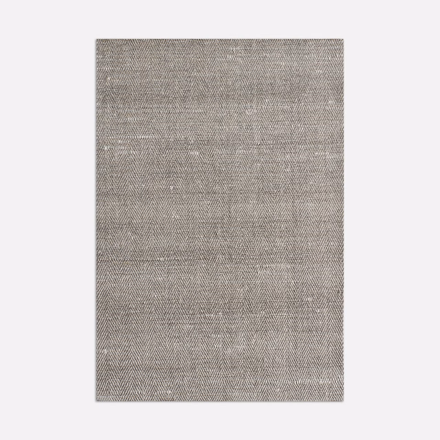 Soft taupe-grey curtain fabric with fine herringbone weave and subtle lighter flecks