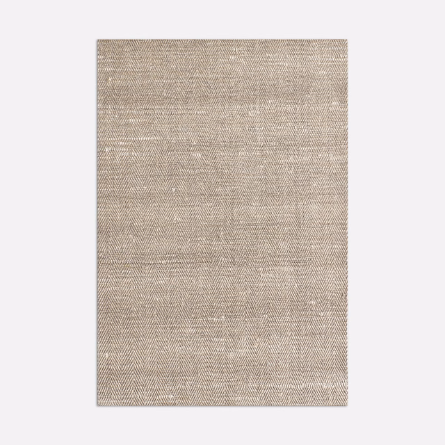 Warm sandstone beige curtain fabric with fine, directional herringbone weave