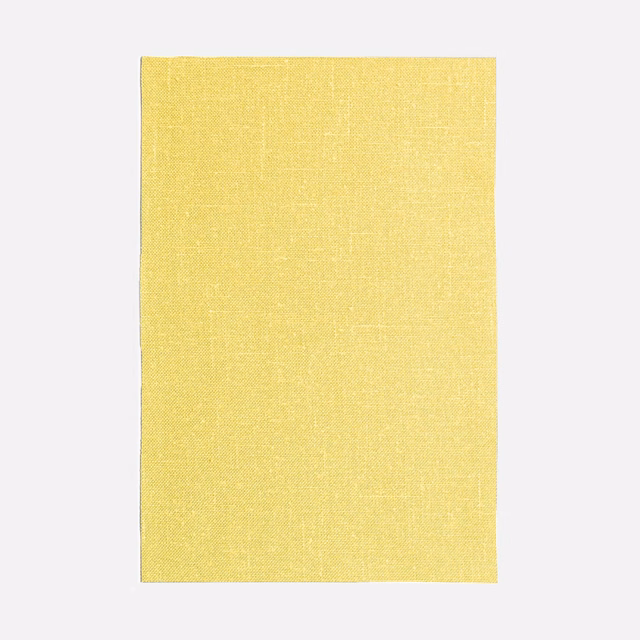 Pale canary yellow curtain fabric with a fine, subtly crosshatched woven surface