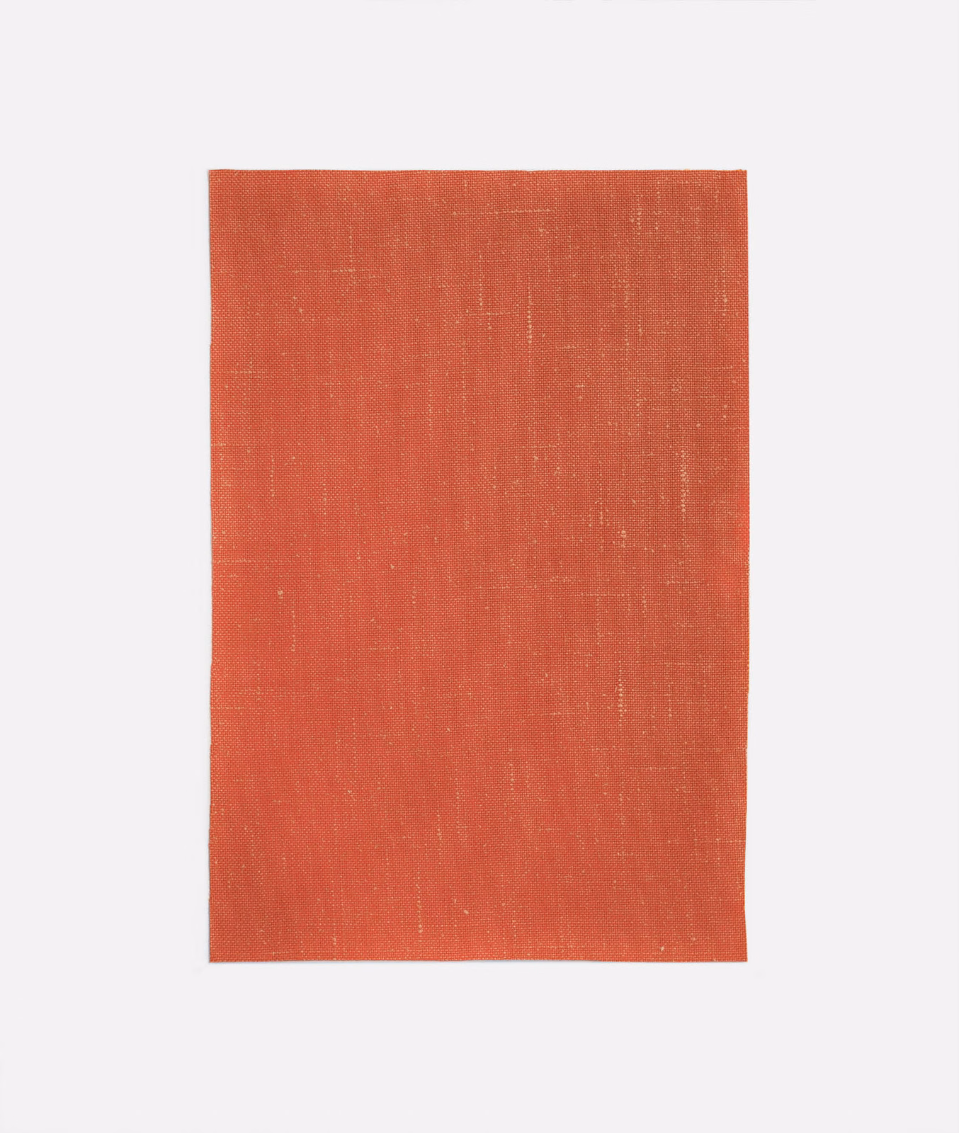 Warm coral-red plain weave with fine crosshatched texture and subtle vertical tonal variation