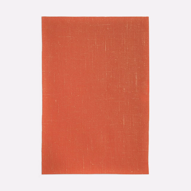 Warm coral-red plain weave with fine crosshatched texture and subtle vertical tonal variation