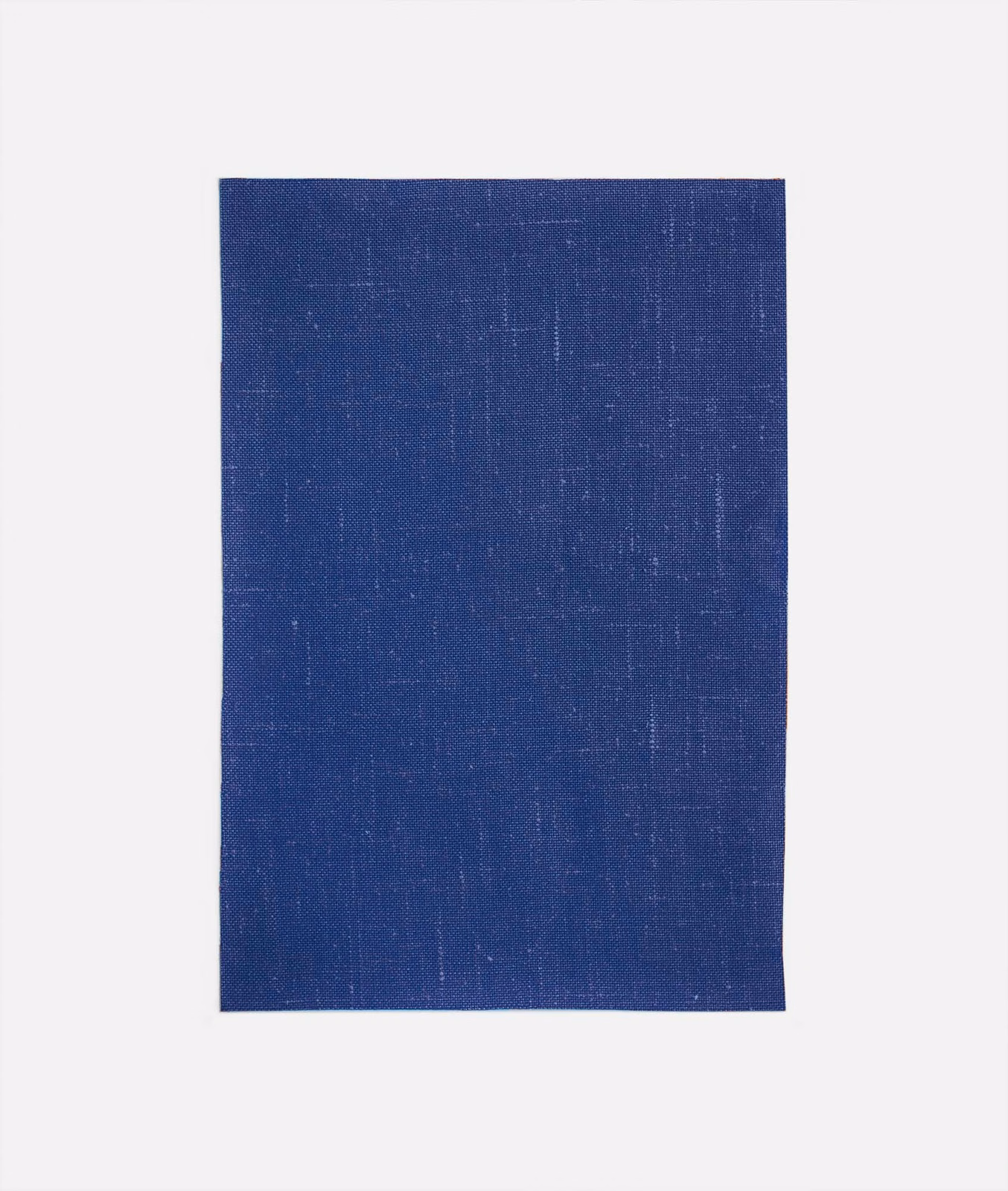 Deep marine blue curtain fabric with fine vertical irregularities and a softly grained weave