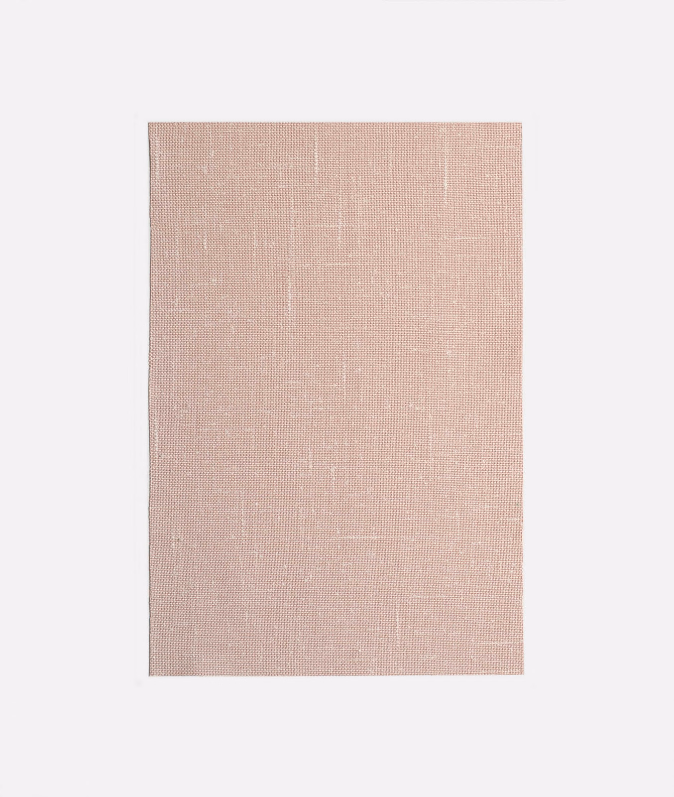 Dusty blush pink textile with subtle woven grid and softly mottled texture