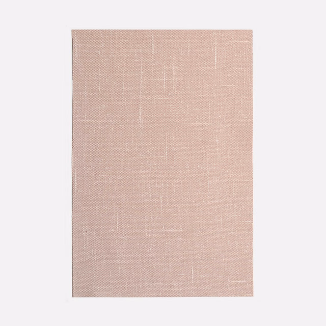 Dusty blush pink textile with subtle woven grid and softly mottled texture
